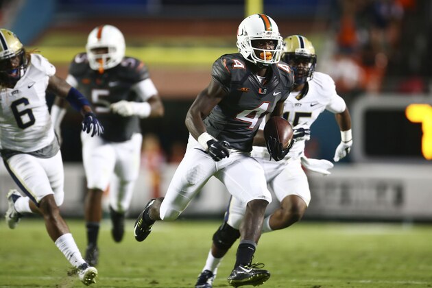 Miami's Phillip Dorsett scores a touchdown during the first half of an NCAA college football game against Pittsburgh in Miami Gardens, Fla., Saturday, Nov. 29, 2014. (AP Photo/J Pat Carter)
