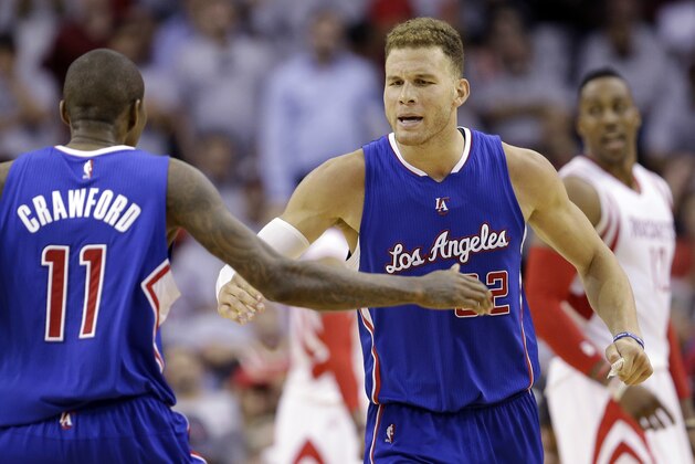 Los Angeles Clippers' Blake Griffin (32) celebrates with teammate Jamal Crawford (11) during the second half of Game 1 in a second-round NBA basketball playoff series against the Houston Rockets, Monday, May 4, 2015, in Houston. (AP Photo/David J. Phillip)