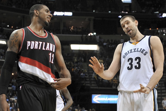 Portland Trail Blazers forward LaMarcus Aldridge (12) and Memphis Grizzlies center Marc Gasol talk during the second half of an NBA basketball game Saturday, Jan. 17, 2015, in Memphis, Tenn. The Grizzlies defeated the Trail Blazers 102-98. (AP Photo/Brandon Dill)