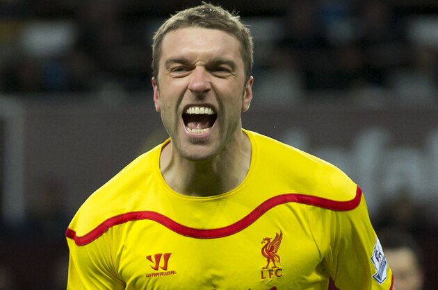 Liverpool's Rickie Lambert celebrates after scoring during the English Premier League soccer match between Aston Villa and Liverpool at Villa Park Stadium, Birmingham, England, Saturday Jan. 17, 2015. (AP Photo/Jon Super)