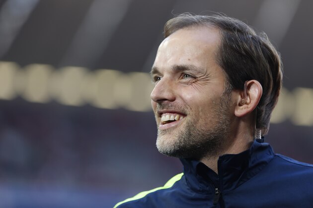 Mainz head coach Thomas Tuchel smiles prior to the German first division Bundesliga soccer match between FC Bayern Munich and FSV Mainz 05, in Munich, southern Germany, Saturday, Oct. 19, 2013. (AP Photo/Matthias Schrader)