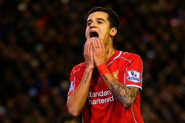 LIVERPOOL, ENGLAND - DECEMBER 29:  Philippe Coutinho of Liverpool reacts after a missed opportunity during the Barclays Premier League match between Liverpool and Swansea City at Anfield on December 29, 2014 in Liverpool, England.  (Photo by Clive Brunskill/Getty Images)
