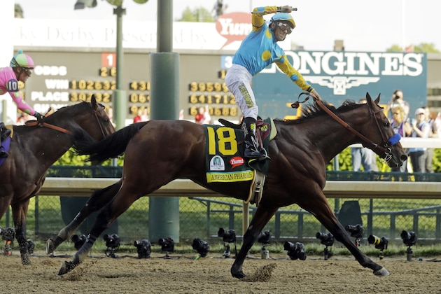 Victor Espinoza rides American Pharoah to victory in the 141st running of the Kentucky Derby horse race at Churchill Downs Saturday, May 2, 2015, in Louisville, Ky. (AP Photo/Morry Gash)