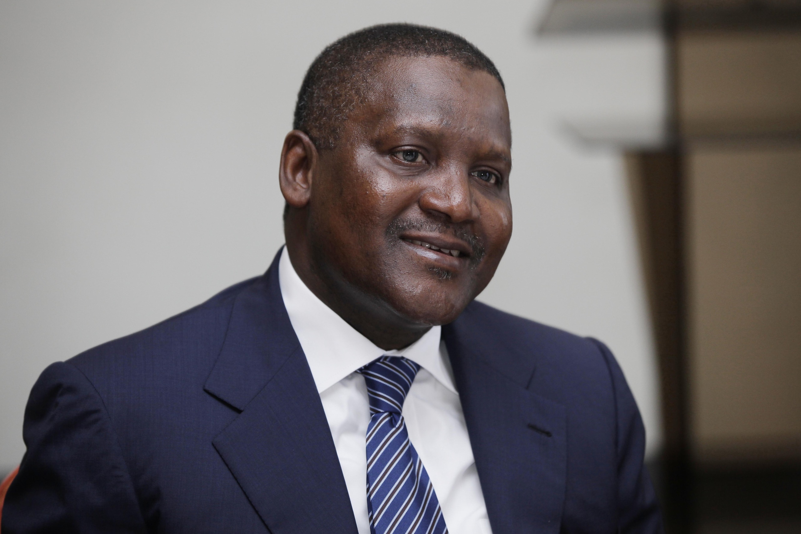 FILE -  In this photo taken, Monday, Oct. 8, 2012 Nigerian billionaire businessman Aliko Dangote  attends  a global business environment meeting in Lagos, Nigeria. Forbes magazine says Dangote, a Nigerian tycoon who built his empire on commodities like flour, sugar and cement, is Africa’s richest man. Dangote topped the Forbes’ list published this week for the second year running. According to Forbes, he has a net worth of $12 billion. (Ap Photo/Sunday Alamba, file)