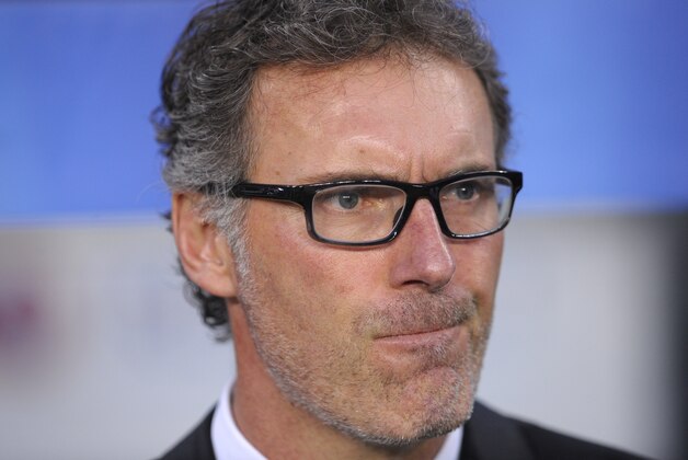 PSG's head coach Laurent Blanc waits for the start of the Champions League quarterfinal second leg soccer match between FC Barcelona and Paris Saint Germain at the Camp Nou Stadium in Barcelona, Spain, Tuesday, April 21, 2015. (AP Photo/Manu Fernandez)