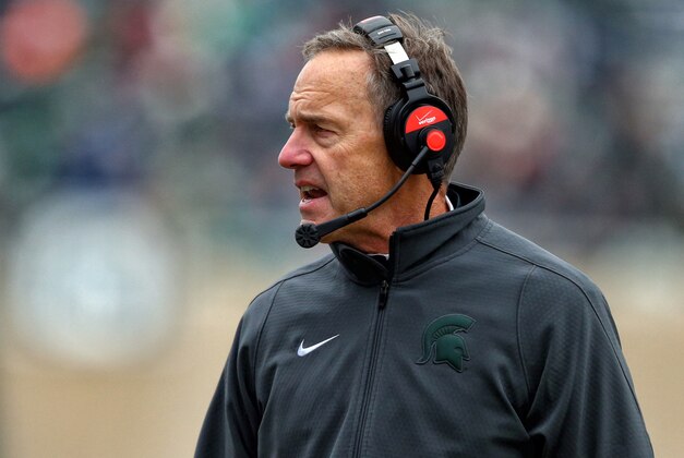 Nov 22, 2014; East Lansing, MI, USA; Michigan State Spartans head coach Mark Dantonio stands on the sidelines during the 2nd half of a game against the Rutgers Scarlet Knights at Spartan Stadium. Mandatory Credit: Mike Carter-USA TODAY Sports