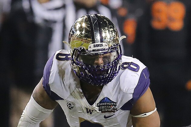 Washington linebacker Hau'oli Kikaha (8) in the first half during the Cactus Bowl NCAA college football game against Oklahoma State, Friday, Jan. 2, 2015, in Tempe, Ariz. (AP Photo/Rick Scuteri)