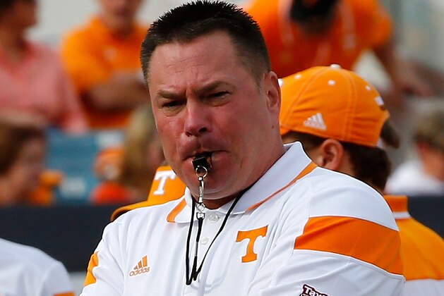 JACKSONVILLE, FL - JANUARY 02:  Head coach Butch Jones of the Tennessee Volunteers watches his team warmup before the TaxSlayer Bowl against the Iowa Hawkeyes at EverBank Field on January 2, 2015 in Jacksonville, Florida.  (Photo by Sam Greenwood/Getty Images)