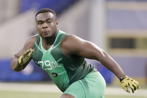 Clemson defensive lineman Grady Jarrett runs a drill at the NFL football scouting combine in Indianapolis, Sunday, Feb. 22, 2015. (AP Photo/Julio Cortez)