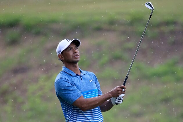 PONTE VEDRA BEACH, FL - MAY 05:  Tiger Woods of the USA plays a shot during a practice round for THE PLAYERS Championship at the TPC Sawgrass Stadium course on May 5, 2015 in Ponte Vedra Beach, Florida.  (Photo by Sam Greenwood/Getty Images)