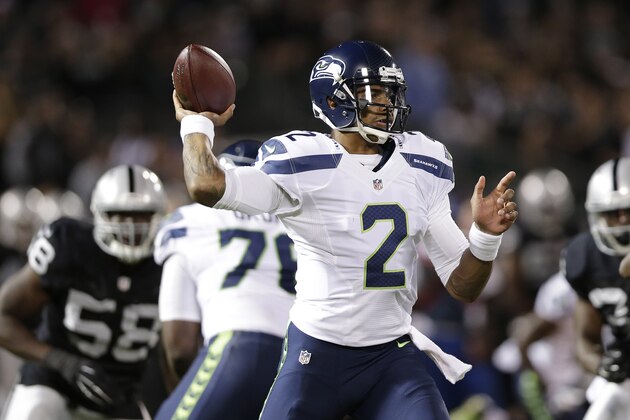 Seattle Seahawks quarterback Terrelle Pryor (2) passes against the Oakland Raiders during the second quarter of an NFL preseason football game in Oakland, Calif., Thursday, Aug. 28, 2014. (AP Photo/Marcio Jose Sanchez)