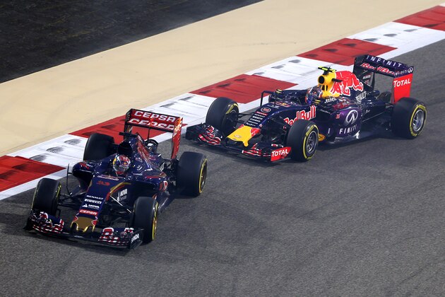 BAHRAIN, BAHRAIN - APRIL 19:  Max Verstappen of Netherlands and Scuderia Toro Rosso is followed by Daniil Kvyat of Russia and Infiniti Red Bull Racing  during the Bahrain Formula One Grand Prix at Bahrain International Circuit on April 19, 2015 in Bahrain, Bahrain.  (Photo by Clive Mason/Getty Images)