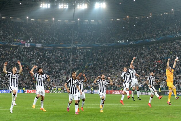 Juventus players celebrate at the end of  the Champions League, semifinal soccer match between Juventus and Real Madrid at the Juventus Stadium in Turin, Italy, Tuesday, May 5, 2015. Juventus won 2-1. (AP Photo/Massimo Pinca)