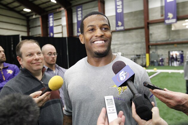 Minnesota Vikings wide receiver Mike Wallace talks with reporters after an NFL offseason player workout in Eden Prairie, Minn., Monday, April 27, 2015. (AP Photo/Ann Heisenfelt)