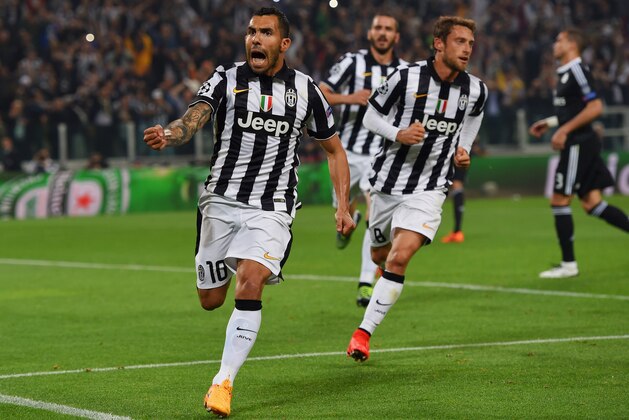 TURIN, ENGLAND - MAY 05:  Carlos Tevez of Juventus (10) celebrates with Claudio Marchisio (8) as he scores their second goal from a penalty during the UEFA Champions League semi final first leg match between Juventus and Real Madrid CF at Juventus Arena on May 5, 2015 in Turin, Italy.  (Photo by Michael Regan/Getty Images)