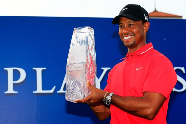 PONTE VEDRA BEACH, FL - MAY 12:  Tiger Woods of the USA holds the winner's trophy after the final round of THE PLAYERS Championship at THE PLAYERS Stadium course at TPC Sawgrass on May 12, 2013 in Ponte Vedra Beach, Florida.  (Photo by Sam Greenwood/Getty Images)