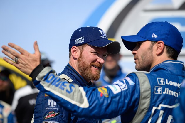 Dale Earnhardt Jr., left, talks with Jimmie Johnson in Victory Lane after the Talladega 500 NASCAR Sprint Cup Series auto race at Talladega Superspeedway, Sunday, May 3, 2015, in Talladega, Ala. (AP Photo/David Tulis)