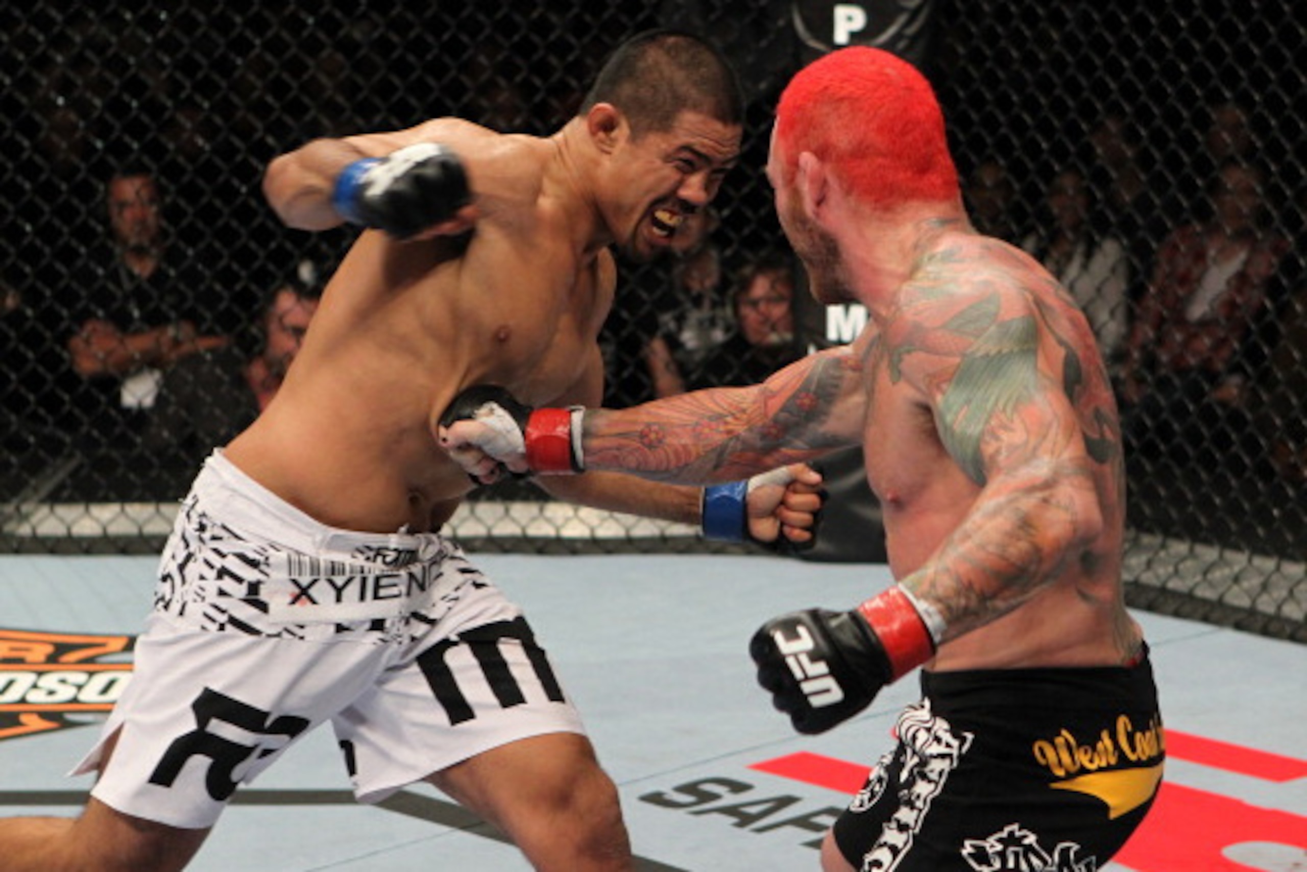 Mark Munoz celebrates his unanimous decision victory over Tim Boetsch after their UFC 162 mixed martial arts middleweight bout at the MGM Grand Garden Arena on Saturday, July 6, 2013, in Las Vegas. (AP Photo/David Becker)