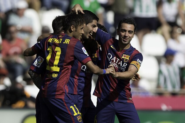 CORDOBA, SPAIN - MAY 02:  Luis Suarez (2ndL) of FC Barcelona celebrates scoring their eight goal with teammates Neymar JR. (L) and Xavi Hernandez (R) during the La Liga match between Cordoba CF and Barcelona FC at El Arcangel stadium on May 2, 2015 in Cordoba, Spain.  (Photo by Gonzalo Arroyo Moreno/Getty Images)