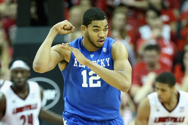 LOUISVILLE, KY - DECEMBER 27:  Karl-Anthony Towns #12  of the Kentucky Wildcats celebrates by flexing his muscles during the game against the Louisville Cardinals at KFC YUM! Center on December 27, 2014 in Louisville, Kentucky.  Kentucky won 58-50.  (Photo by Andy Lyons/Getty Images)