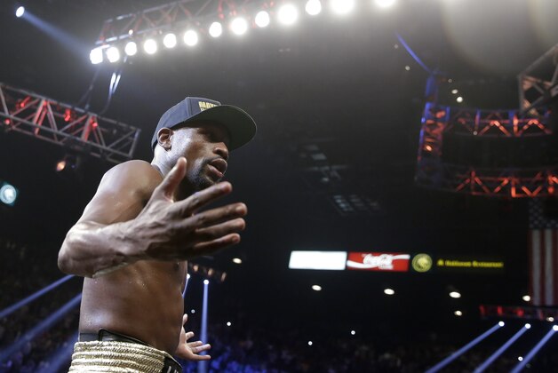 Floyd Mayweather Jr., celebrates his unanimous decision victory over Manny Pacquiao, from the Philippines, at the finish of their welterweight title fight on Saturday, May 2, 2015 in Las Vegas. (AP Photo/Isaac Brekken)
