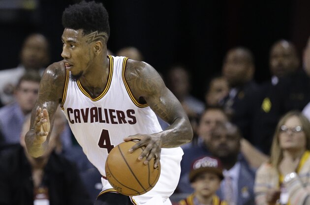 Cleveland Cavaliers guard Iman Shumpert (4) drives against the Chicago Bulls during the first half of Game 1 in a second-round NBA basketball playoff series Monday, May 4, 2015, in Cleveland. (AP Photo/Tony Dejak)
