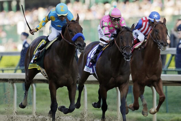 Victor Espinoza rides American Pharoah to victory in the 141st running of the Kentucky Derby horse race at Churchill Downs Saturday, May 2, 2015, in Louisville, Ky. (AP Photo/Jeff Roberson)