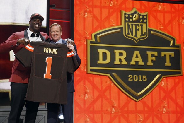 Florida State offensive lineman Cameron Erving poses for photos with NFL commissioner Roger Goodell after being selected by the Cleveland Browns as the 19th pick in the first round of the 2015 NFL Draft,  Thursday, April 30, 2015, in Chicago. (AP Photo/Charles Rex Arbogast)