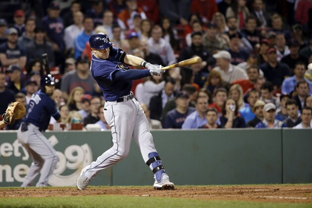 Tampa Bay Rays' Evan Longoria hits a single during the fourth inning of a baseball game against the Boston Red Sox at Fenway Park in Boston, Tuesday, May 5, 2015. It was Longoria's 1000th career hit. (AP Photo/Elise Amendola)