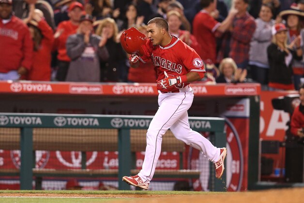 ANAHEIM, CA - MAY 05:  Carlos Perez #58 of the Los Angeles Angels of Anaheim  takes off his helmet as he rounds third after leading off the ninth inning with a walk off home run to win the game against the Seattle Mariners at Angel Stadium of Anaheim on May 5, 2015 in Anaheim, California.  The Angels won 5-4.  (Photo by Stephen Dunn/Getty Images)