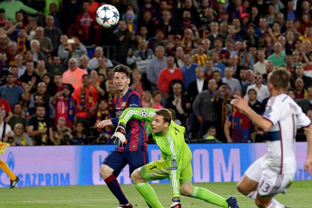 Barcelona's Lionel Messi, left scores his second goal past Bayern's goalkeeper Manuel Neuer during the Champions League semifinal first leg soccer match between Barcelona and Bayern Munich at the Camp Nou stadium in Barcelona, Spain, Wednesday, May 6, 2015.  (AP Photo/Emilio Morenatti)