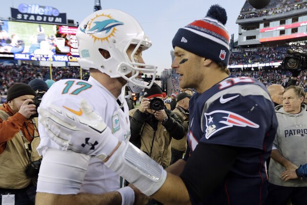 Miami Dolphins quarterback Ryan Tannehill, left, congratulates New England Patriots quarterback Tom Brady, right, after the Patriots beat the Dolphins 41-13 in an NFL football game Sunday, Dec. 14, 2014, in Foxborough, Mass. (AP Photo/Charles Krupa)