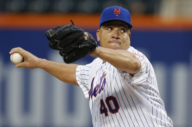 New York Mets starting pitcher Bartolo Colon delivers in the first inning of a baseball game against the Baltimore Orioles in New York, Tuesday, May 5, 2015. (AP Photo/Kathy Willens)