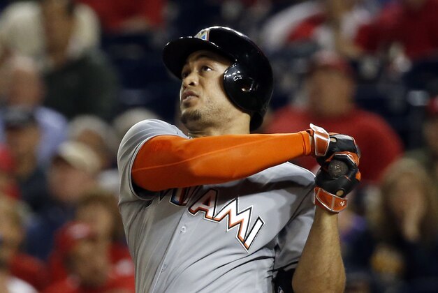 Miami Marlins right fielder Giancarlo Stanton (27) watches a long foul ball during a baseball game against the Washington Nationals at Nationals Park, Tuesday, May 5, 2015, in Washington. (AP Photo/Alex Brandon)