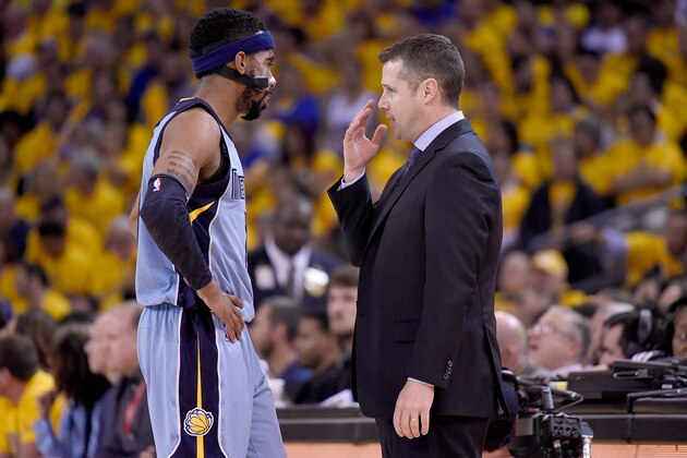 OAKLAND, CA - MAY 05:  Head Coach David Joerger of the Memphis Grizzlies talks with his player Mike Conley #11 while there's a break in the action against the Golden State Warriors during Game Two of the Western Conference Semifinals of the NBA Playoffs at ORACLE Arena on May 5, 2015 in Oakland, California. NOTE TO USER: User expressly acknowledges and agrees that, by downloading and or using this photograph, User is consenting to the terms and conditions of the Getty Images License Agreement.  (Photo by Thearon W. Henderson/Getty Images)