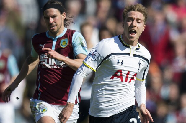 Tottenham's Christian Eriksen, right, keeps the ball from Burnley's George Boyd during the English Premier League soccer match between Burnley and Tottenham at Turf Moor Stadium, Burnley, England, Sunday April 5, 2015. (AP Photo/Jon Super)
