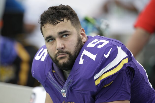Minnesota Vikings tackle Matt Kalil (75) looks up from the sidelines during the second half of an NFL football game against the Miami Dolphins, Sunday, Dec. 21, 2014, in Miami Gardens, Fla. The Dolphins defeated the Vikings 37-35.  (AP Photo/Lynne Sladky)