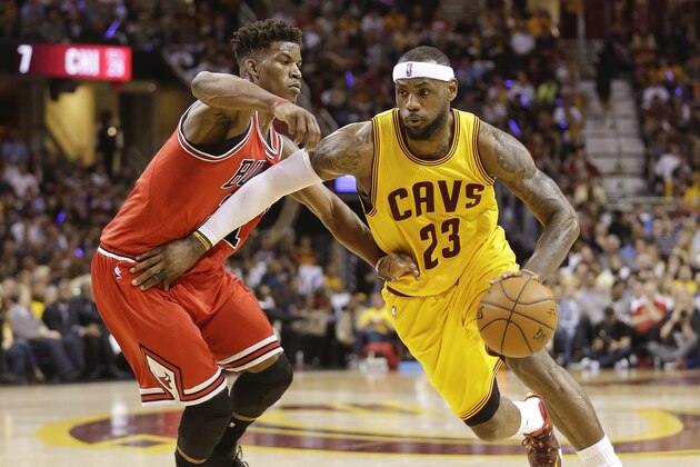 Cleveland Cavaliers forward LeBron James (23) drives against Chicago Bulls guard Jimmy Butler (21) during the first half of Game 2 in a second-round NBA basketball playoff series Wednesday, May 6, 2015, in Cleveland. (AP Photo/Tony Dejak)