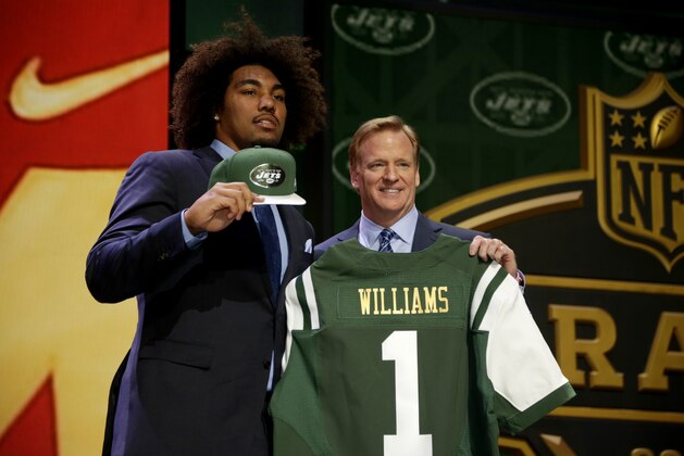 Leonard Williams stands on stage with NFL commissioner Roger Goodell, right, after being drafted sixth by the New York Jets in the first round of the 2015 NFL Draft, Thursday, April 30, 2015, in Chicago.  (Jeff Haynes/AP Images for Panini)