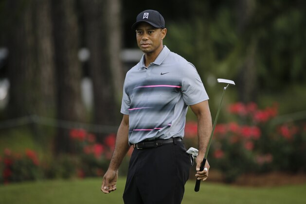 Tiger Woods putts on the 13th green during a practice round for The Players Championship golf tournament at Sawgrass Wednesday, May 6, 2015, in Ponte Vedra Beach, Fla. (AP Photo/Chris O'Meara)