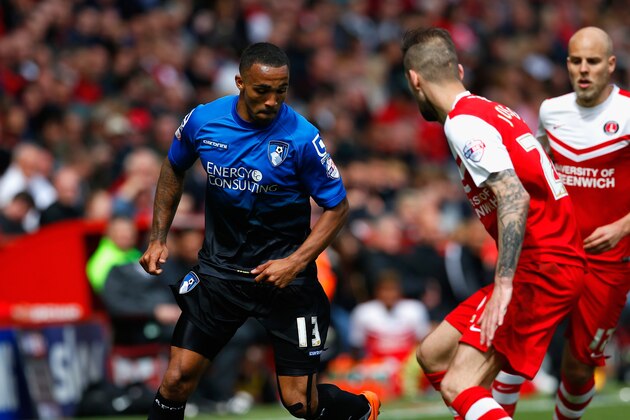 LONDON, ENGLAND - MAY 02:  Callum Wilson of Bournemouth and Roger Johnson of Charlton compete for the ball during the Sky Bet Championship match between Charlton Athletic and AFC Bournemouth at The Valley on May 2, 2015 in London, England.  (Photo by Steve Bardens/Getty Images)
