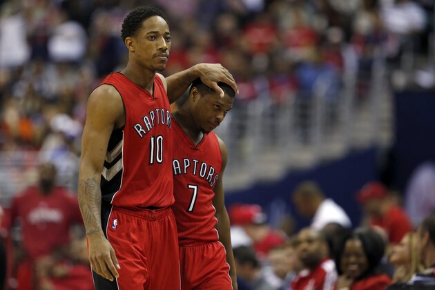 Toronto Raptors guards DeMar DeRozan (10) and Kyle Lowry (7) walk to the bench in the second half of Game 4 in the first round of the NBA basketball playoffs against the Washington Wizards, April 26, 2015, in Washington. The Wizards won 125-94 to complete the first sweep of a seven-game series in club history, and advancing them to the second-round. (AP Photo/Alex Brandon)