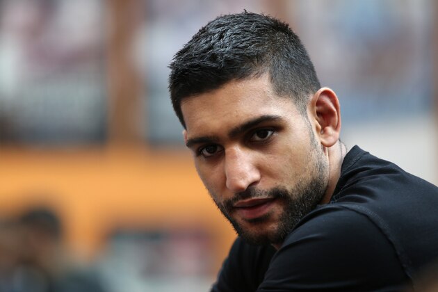 BOLTON, ENGLAND - MAY 12:  Amir Khan answers questions from the media during the launch of The Amir Khan Foundation at the at the Gloves Community Centre on May 12, 2014 in Bolton, England.  (Photo by Jan Kruger/Getty Images)