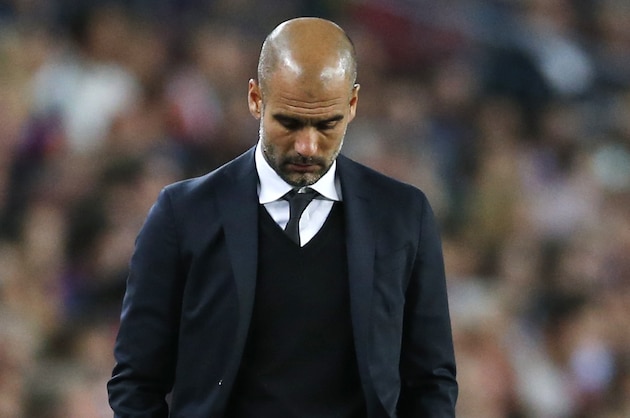 Bayern's head coach Pep Guardiola walks through the coaching zone during the Champions League semifinal first leg soccer match between Barcelona and Bayern Munich at the Camp Nou stadium in Barcelona, Spain, Wednesday, May 6, 2015.  (AP Photo/Manu Fernandez)