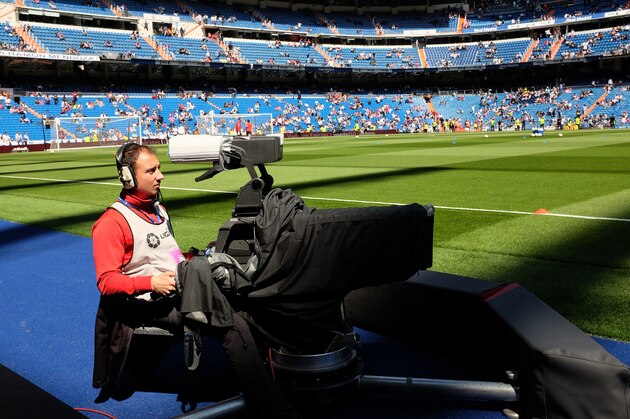 MADRID, SPAIN - APRIL 11:  A tv cameraman operates a camera prior to   the La Liga match between Real Madrid and Eibar at Estadio Santiago Bernabeu on April 11, 2015 in Madrid, Spain.  (Photo by Denis Doyle/Getty Images)
