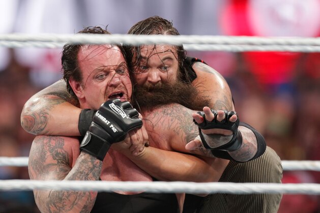 Bray Wyatt keeps his opponent The Undertaker in a hold at Wrestlemania XXXI, on Sunday, March 29, 2015 in Santa Clara, CA. 2015 marks the first year Wrestlemania will be held in the San Francisco Bay Area, being made available to viewers in 177 countries via the WWE Network. (Don Feria/AP Images for WWE)