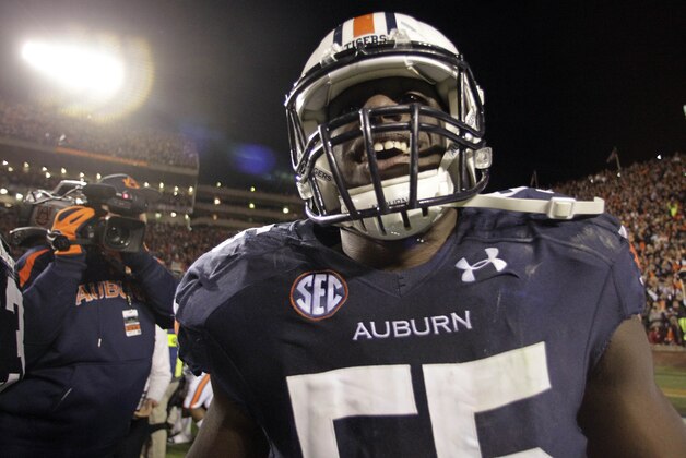 Nov 30, 2013; Auburn, AL, USA; Auburn Tigers defensive end Carl Lawson (55) reacts after defeating the Alabama Crimson Tide during the fourth quarter at Jordan Hare Stadium. Auburn Tigers won 34-28. Mandatory Credit: John Reed-USA TODAY Sports