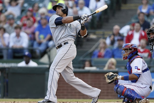 Seattle Mariners' Nelson Cruz hits a home run against the Texas Rangers during second inning of a baseball game, Wednesday, April 29, 2015, in Arlington, Texas. (AP Photo/Tony Gutierrez)