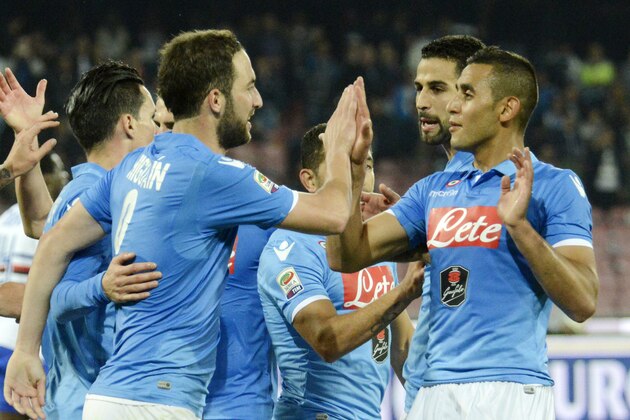 Napoli's Gonzalo Higuain, left, celebrates with his teammates after scoring during a Serie A soccer match between Napoli and Sampdoria, at the San Paolo stadium in Naples, Italy, Sunday, April 26, 2015. (AP Photo/Salvatore Laporta)