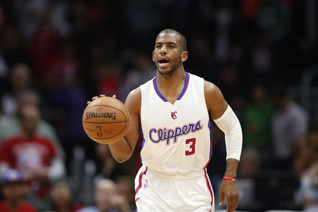 Los Angeles Clippers' Chris Paul dribbles the ball against the Denver Nuggets during the first half of an NBA basketball game, Monday, April 13, 2015, in Los Angeles. (AP Photo/Danny Moloshok)